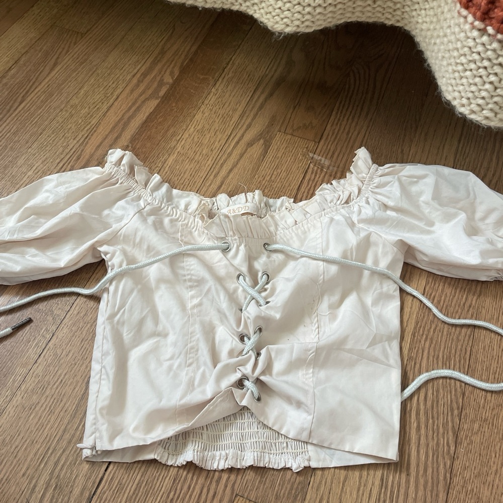 white corset top in good condition size: M
